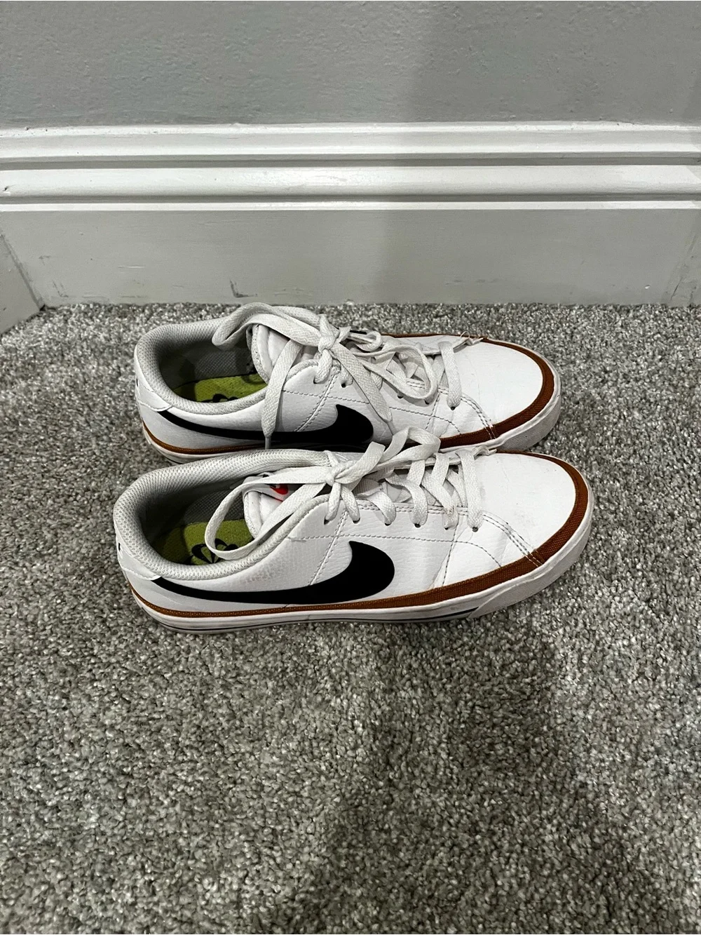 Nike women’s White Sneakers with Black Swoosh and Brown Trim